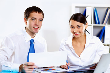 Two young business collegue in office