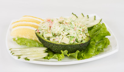 Crab meat salad with green caviar in avocado - japan cusine