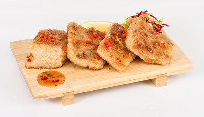 Fried fish fillets with  salad.