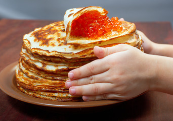 Russian pancakes  with red caviar
