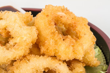 Deep batter fried squid rings calamari with green salad