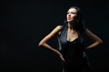 Fototapeta na wymiar Beautiful young woman on black background