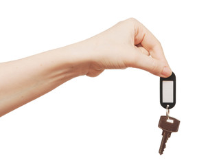 silver key with blank tag in hand