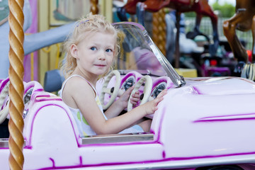little girl on carousel