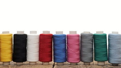 colorful threads for embroidery on a white background