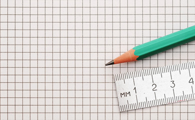 steel ruler and wood pencil on white