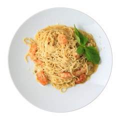 Tagliolini with pesto and shrimps closeup - top view