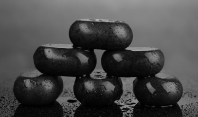 Fototapeta na wymiar Spa stones with water drops on grey background