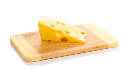 Cheese on cutting board isolated on white