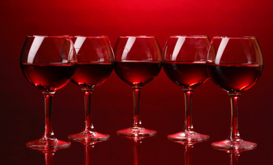 Wineglasses on red background