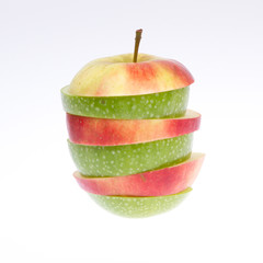 Fototapeta na wymiar A sliced green and red apple isolated