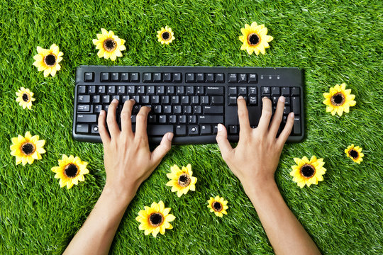 Typing outdoor on grass