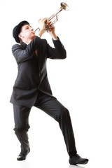 Portrait of a young man playing his Trumpet plays isolated white