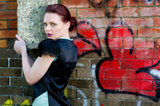 Pretty Young Female Against Grafitti Wall