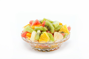 Fresh fruits salad on white background