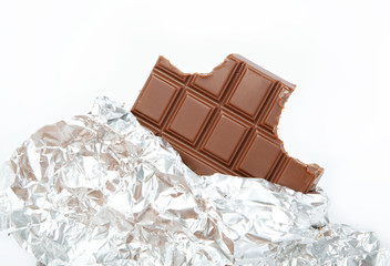 Chocolate bar in foil isolated on white background