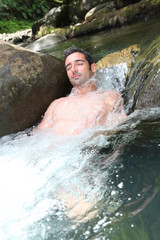 Closeup of man enjoying, river spa water
