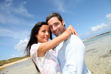 Couple of lovers embracing each other at the beach