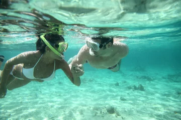 Foto op Aluminium Couple snorkeling in Caribbean waters © goodluz