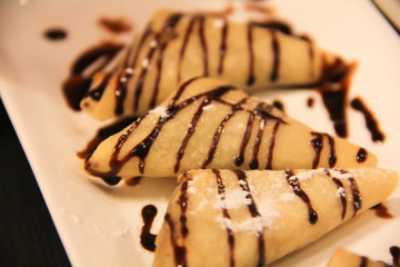 Triangular Pastry topped with chocolates
