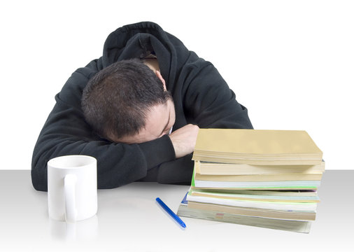 Young Man Fallen Asleep Over Books