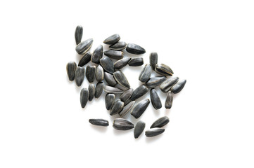 many sunflower seeds on white backgroun