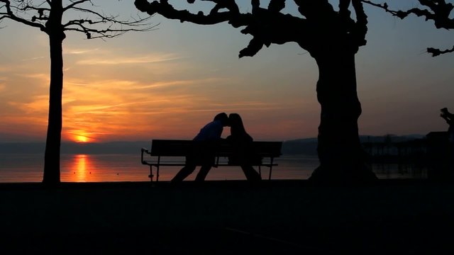 couple kissing at beach