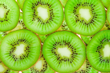 close up background of green kiwi slices