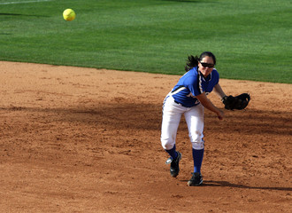 Softball Player Throwing Ball