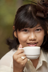 Portrait of  lady drinking coffee