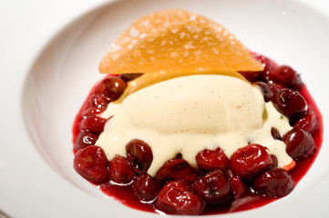Warm cherries with vanilla ice cream
