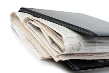 Newspaper and a laptop