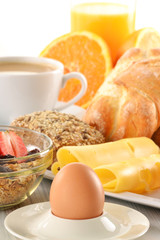 Breakfast with coffee, rolls, egg, orange juice, muesli and chee