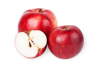 Two ripe red apples and half of apple. Isolated on a white backg
