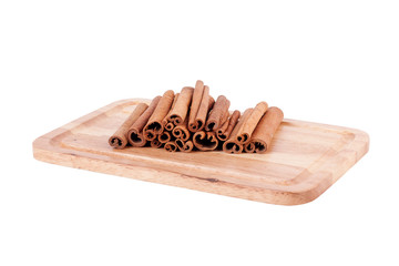 cinnamon sticks on wood background