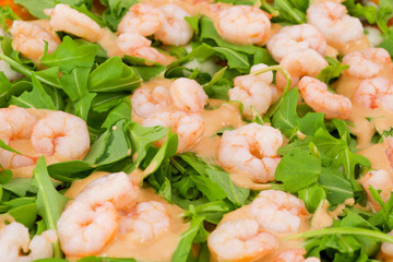 shrimp cocktail with cocktail sauce and arugula