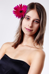 Portrait of a young women with gerbera