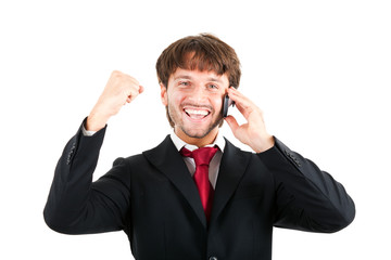 Happy businessman talking at the phone