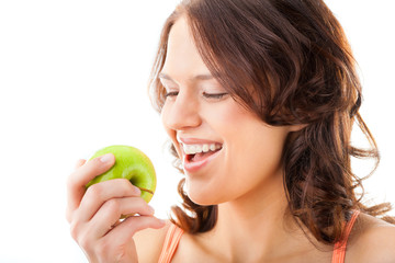 Young woman bites in a fresh and healthy apple