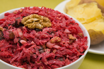 Salad with beets, dried plums, nuts