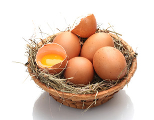 chicken eggs in a nest isolated on white