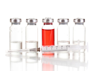 Syringe and medical ampoules isolated on white