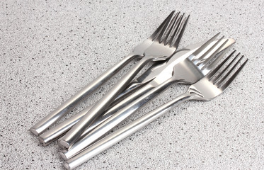 Forks and knives on marble table