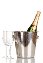 Bottle of champagne in bucket and goblets isolated on white