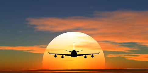 Fototapeta na wymiar Samolot latający na tle zachodu słońca