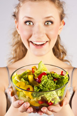 Happy healthy woman with salad