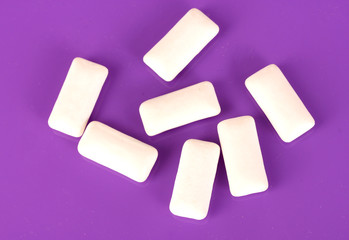 Chewing gums on purple background