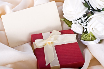 Holiday gift with a bouquet of the bride and a card