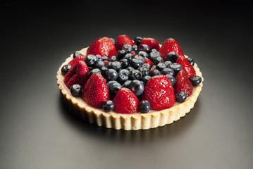 dessert fruit cake with strawberries and blueberries