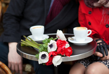 Dating couple in a Parisian cafe
